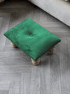 Small green footrest pouffe