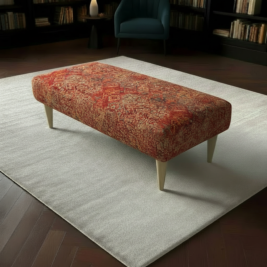 Designer hallway seating bench with artistic multi-toned upholstered fabric and sleek wooden legs