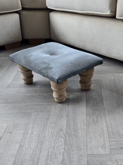 Small dark grey footrest pouffe