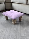 Small pink footrest pouffe