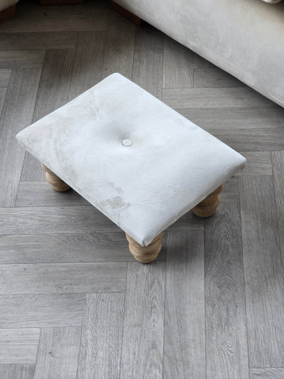 Small creamy white footrest pouffe