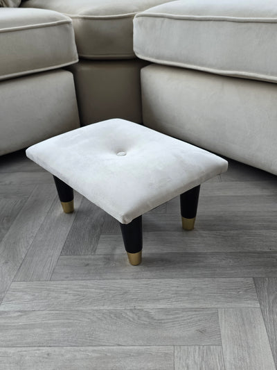 Small creamy white footrest pouffe