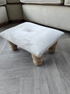 Small creamy white footrest pouffe